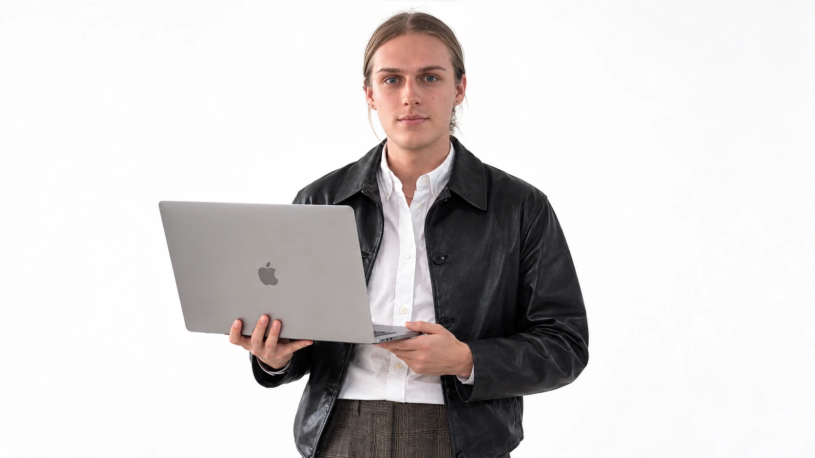 Barys Rylou holding an open MacBook