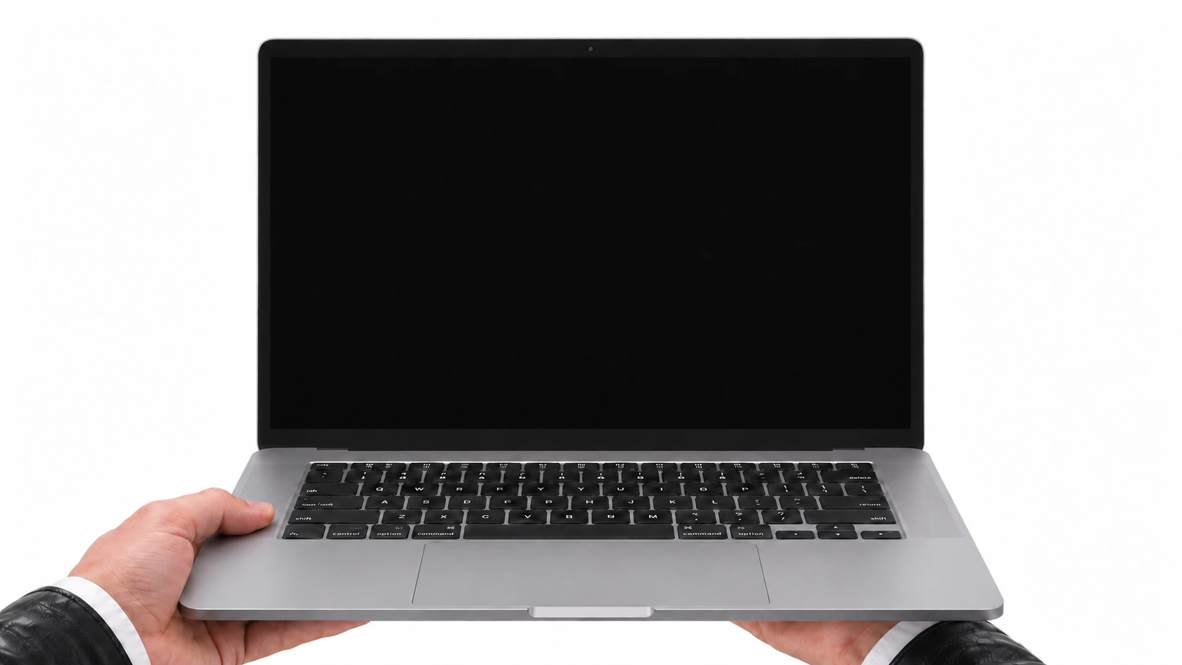 An open MacBook held by Barys